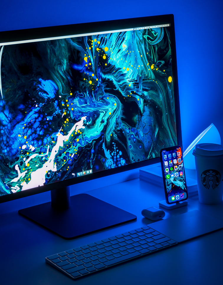 A matching background for a desktop and mobile phone setup representing branding and consistency across channels with a blue theme in a portrait cropping ratio